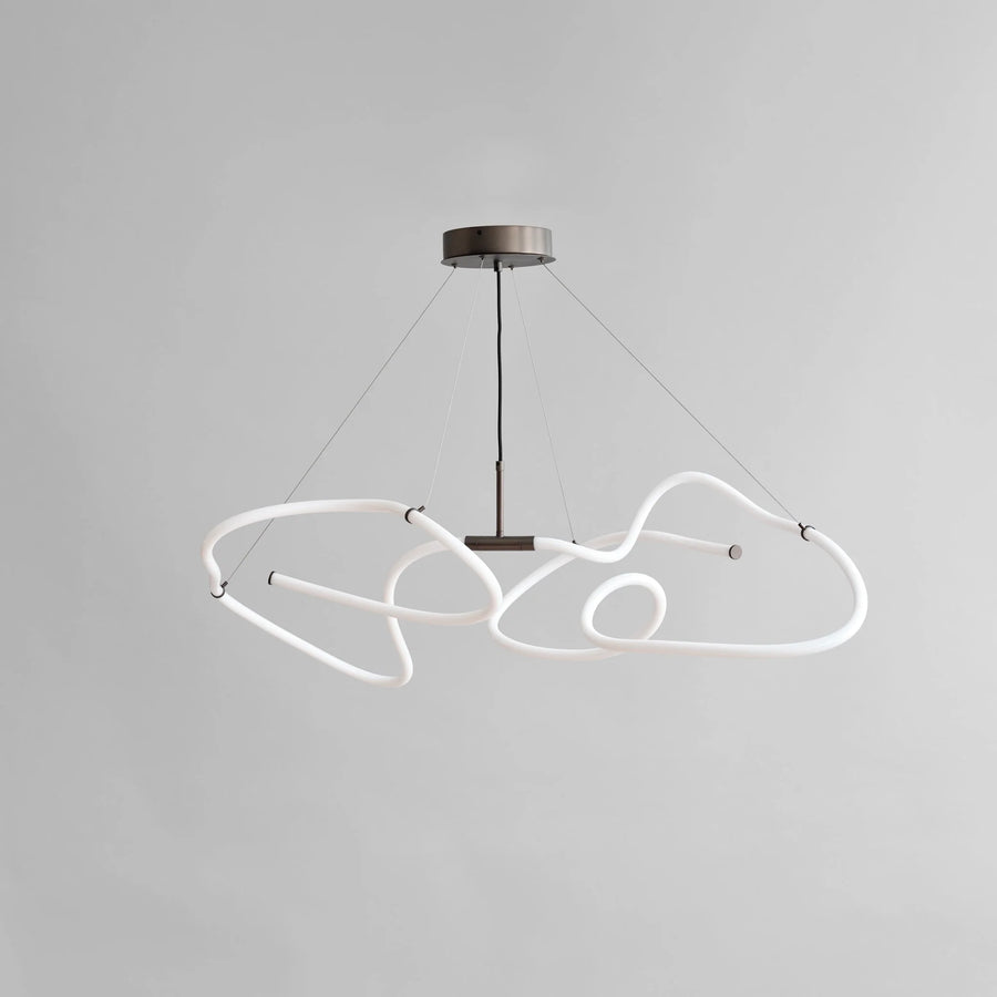 Modern pendant light with white curved neon lights on a gray background