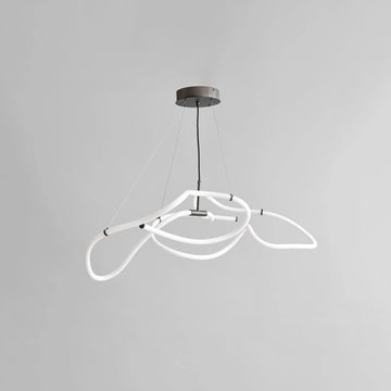 Neon pendant light with white loops on a gray background from 101 Copenhagen available at Spacio retail stores in Mumbai & Kolkata. 