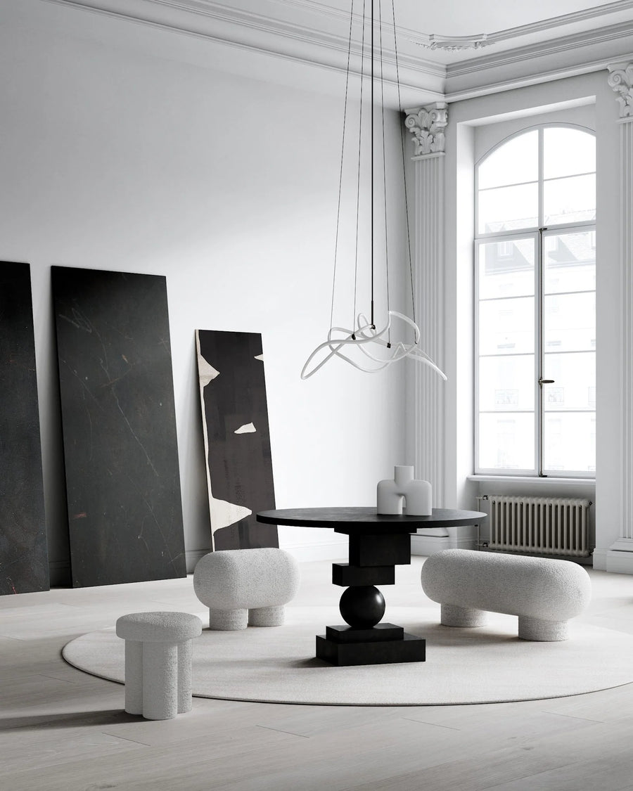 Modern interior design with black and white furniture in a bright room.