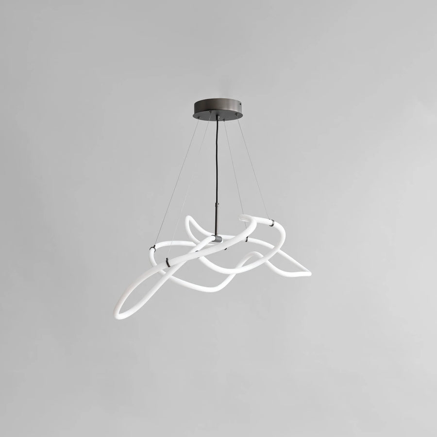 Modern pendant light with white circular design on a gray background
