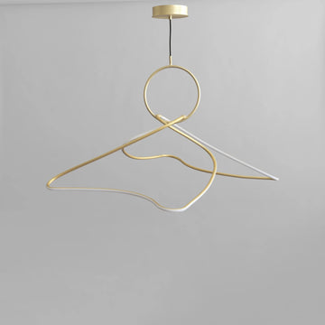 Gold hanger pendant light on a gray background from 101 Copenhagen available at Spacio retail stores in Mumbai & Kolkata. 