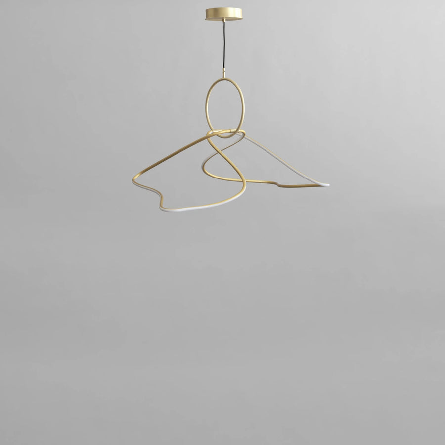 Gold pendant light fixture on a gray background