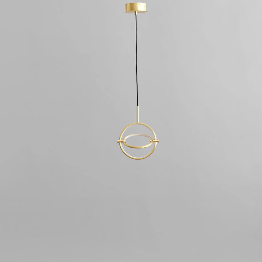 Minimal Scandinavian design Brass pendant light on a gray background from 101 Copenhagen available at Spacio retail stores in Mumbai & Kolkata.