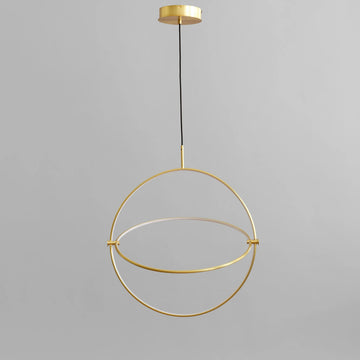 Brass pendant light fixture on a gray background from 101 Copenhagen available at Spacio retail stores in Mumbai & Kolkata. 