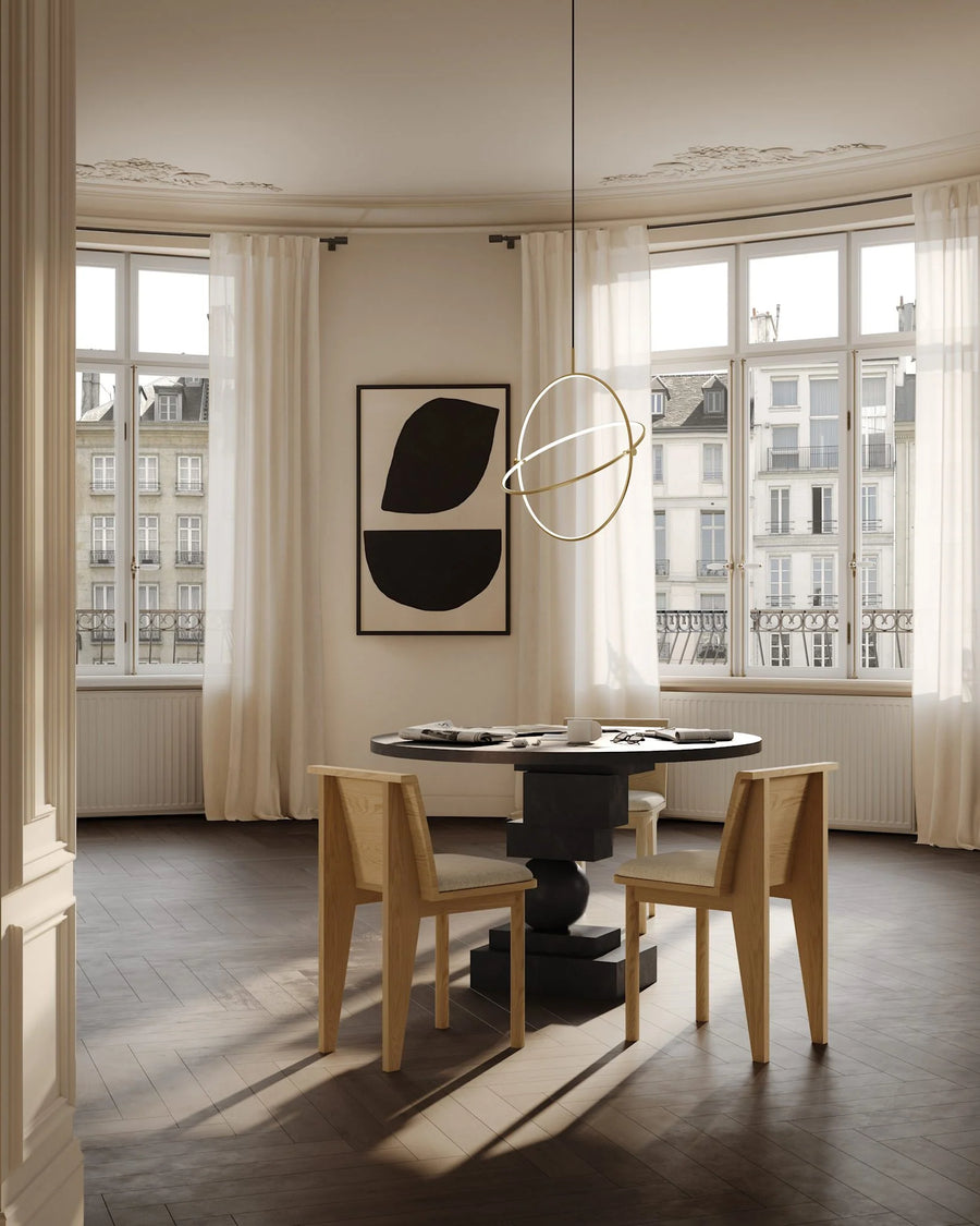 Modern Japandi theme dining room with round table and chairs, large windows, and abstract wall art.