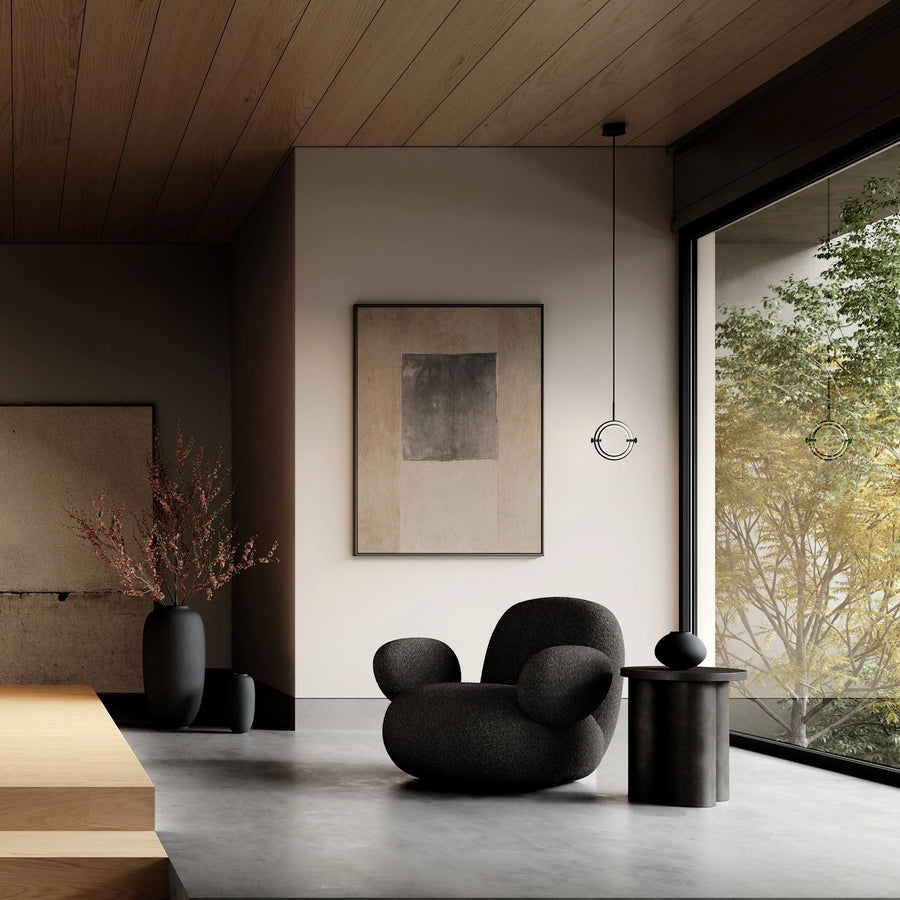 Modern Japandi theme interior with a black armchair, abstract painting, and large window.