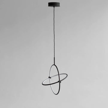 Modern black pendant light on a gray background