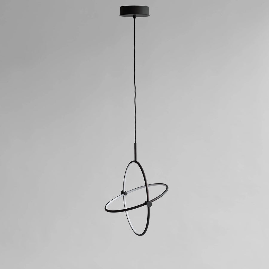 Modern black pendant light on a gray background