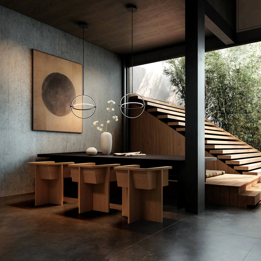 Modern interior design with wooden furniture, abstract art, and a view of trees.