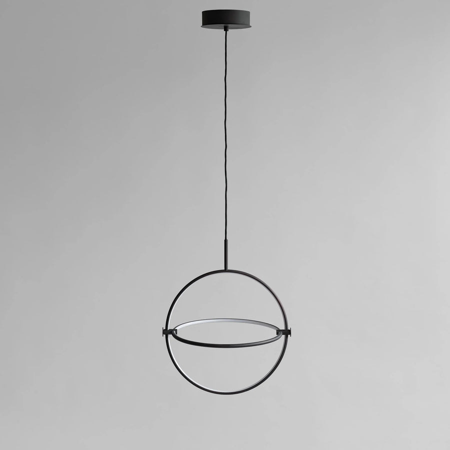 Modern black pendant light on a gray background
