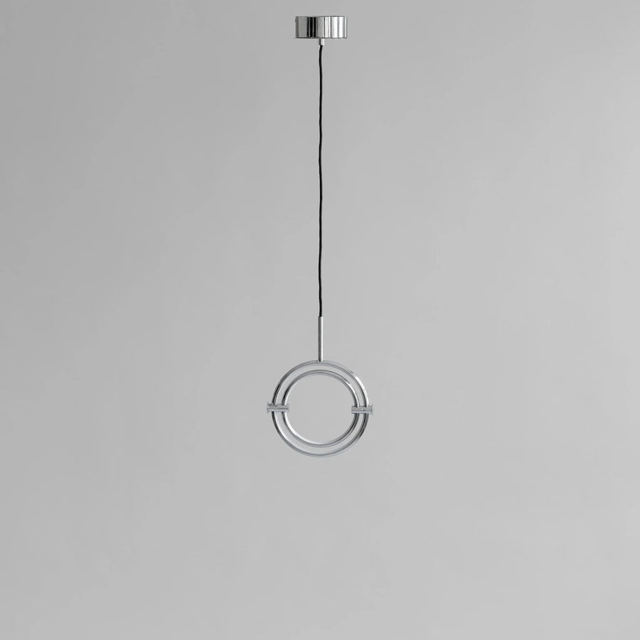 Modern pendant light with circular design on a gray background