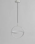 Modern pendant light with a circular design on a gray background