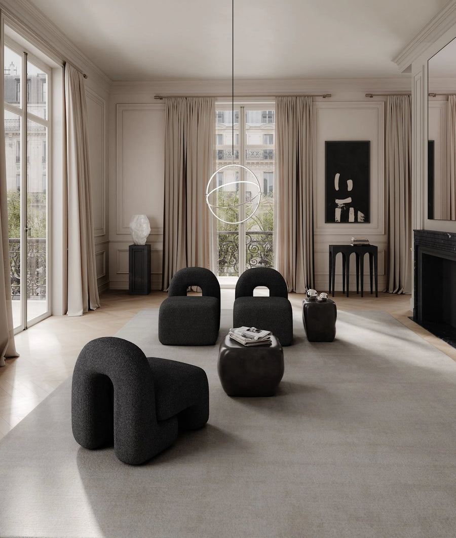 Modern Japandi theme living room with furniture, sculptural vase, pendant light and large windows.