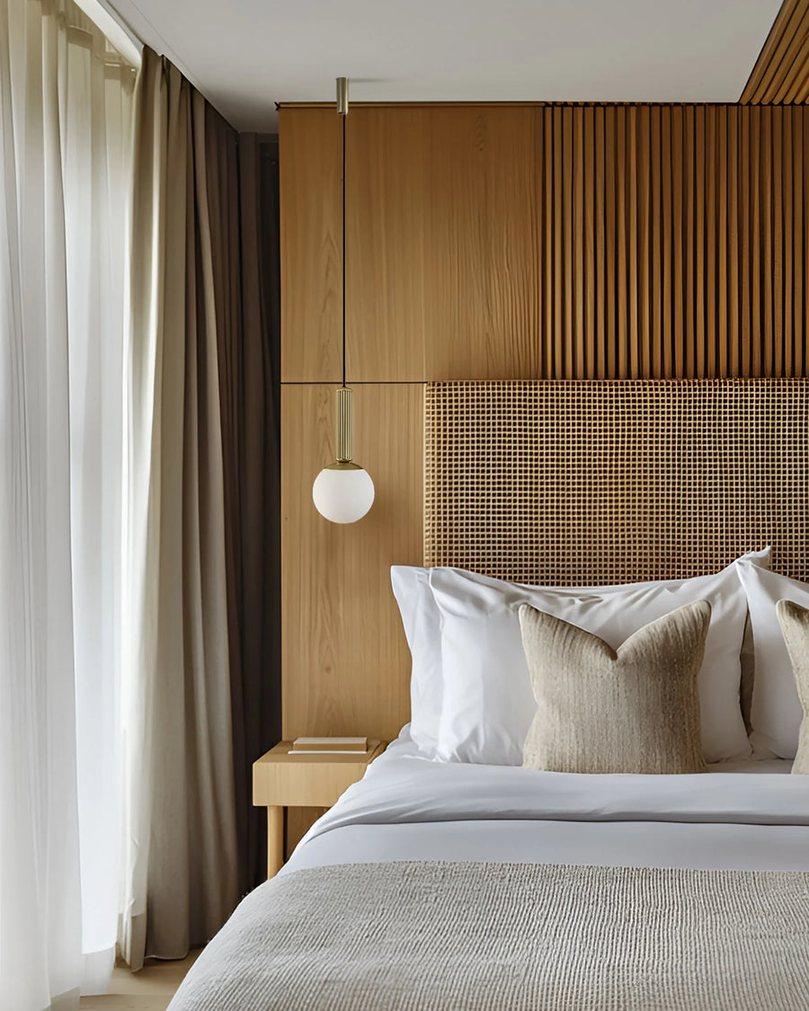 Modern Japandi theme bedroom with wooden headboard and decorative pillows