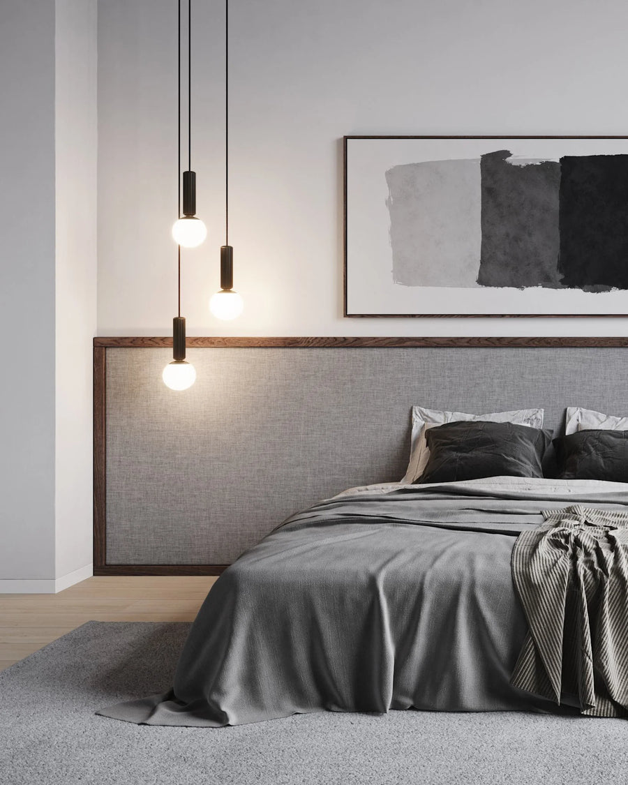 Modern Japandi theme bedroom with gray bedding, abstract art, and pendant lights.