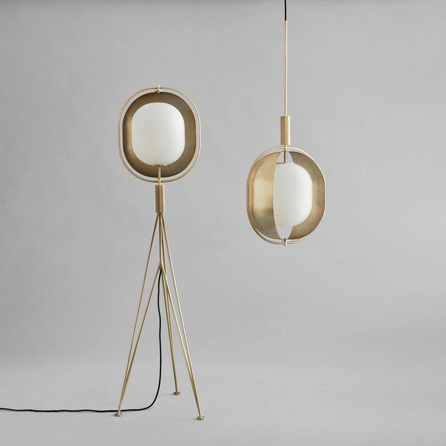 Modern & minimal floor lamp and pendant light with brass frames on a gray background from 101 Copenhagen, available with Spacio retail stores in Mumbai & Kolkata.