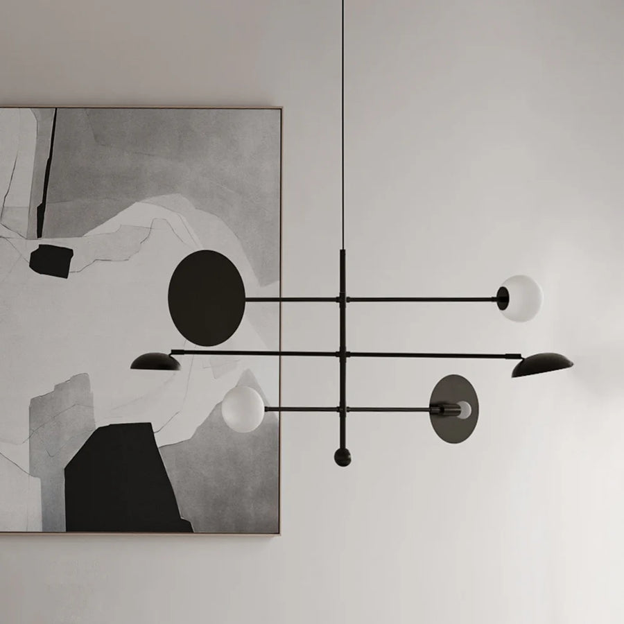 Modern chandelier with abstract art in the background