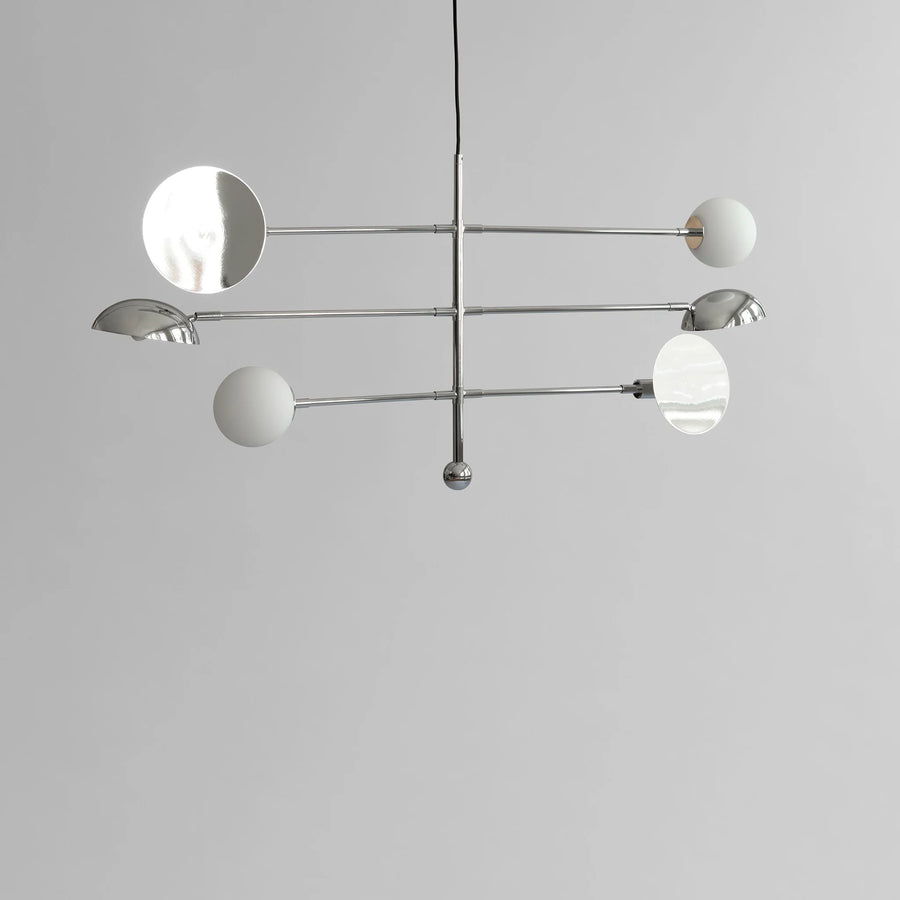 Modern chandelier with white spherical lights on a gray background
