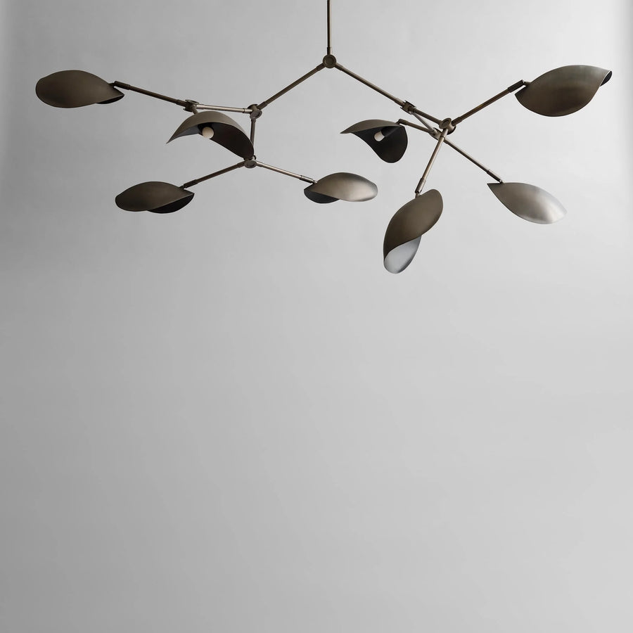 Modern chandelier with leaf-like design on a plain background in bronze finish from 101 Copenhagen available at Spacio retail stores in Mumbai & Kolkata. 