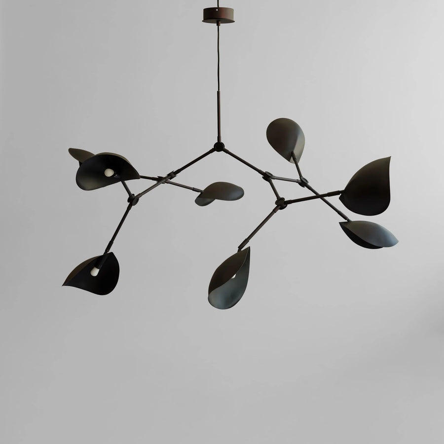 Modern black chandelier against a gray background