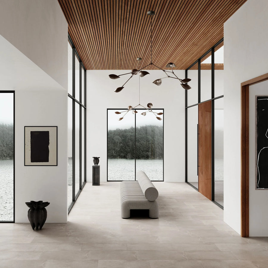 Modern interior with large windows, wooden ceiling, and minimal decor.