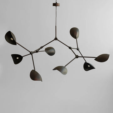 Modern chandelier with leaf-like design on a plain background from 101 Copenhagen available at Spacio retail stores in Mumbia & Kolkata. 