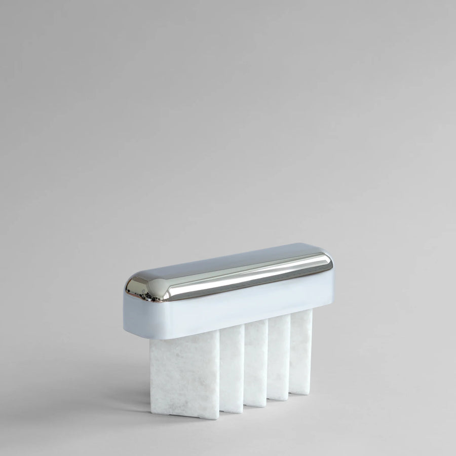 Rectangular portable table lamp with metallic top and marble base on a light gray background