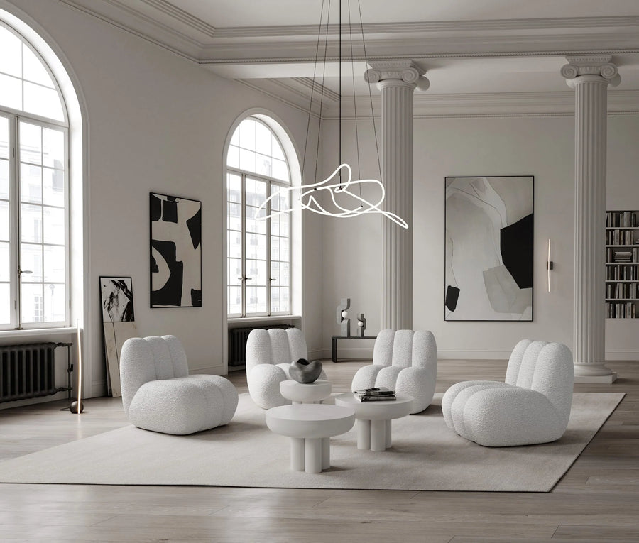 Modern living room with white furniture and abstract art