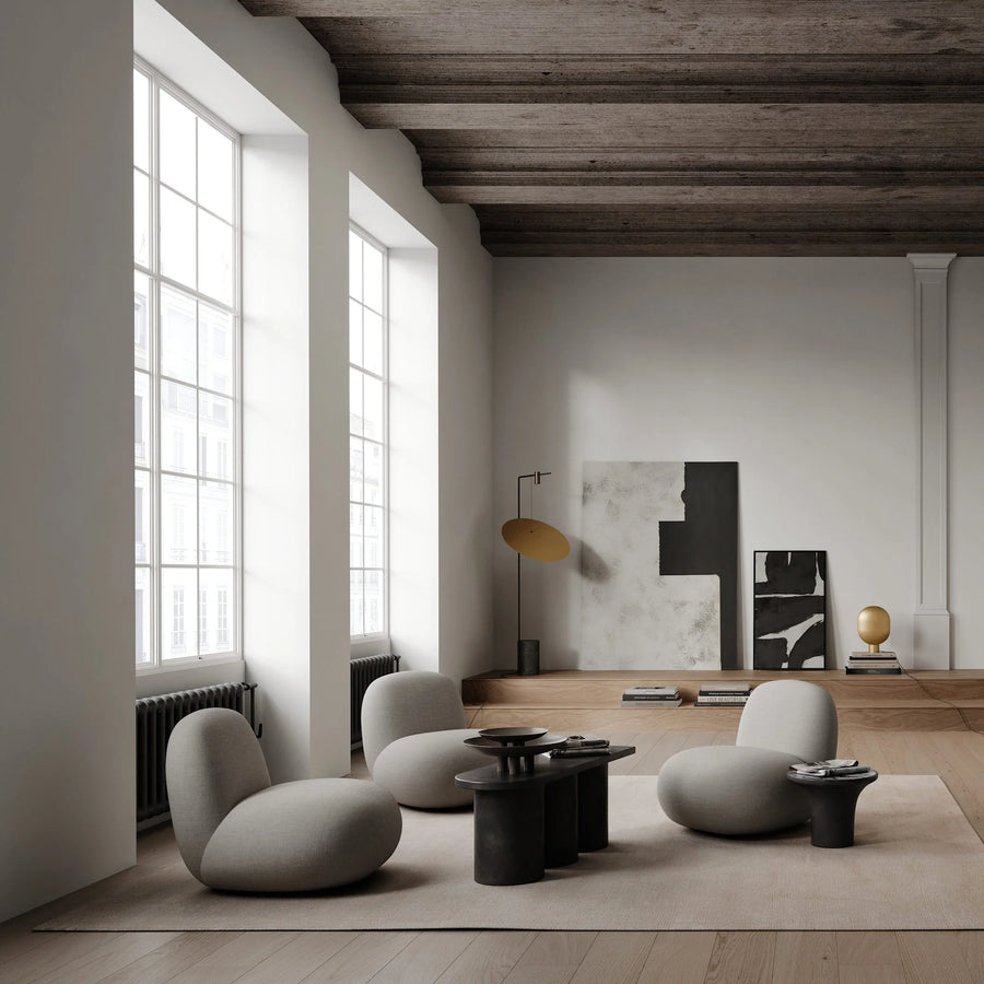 Modern living room with gray furniture and a wooden floor.