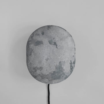 Clam Wall Light Oxidized by 101 Copenhagen on a light grey background available at Spacio retail stored in Mumbai & Kolkata. 
