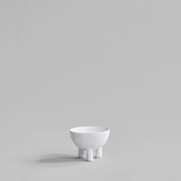 White ceramic bowl on a light gray background from 101 Copenhagen at Spacio retail stores in Mumbai & Kolkata. 