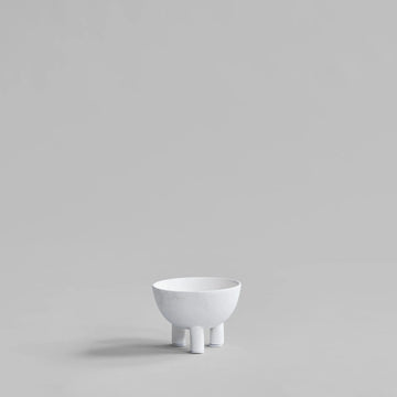 White ceramic bowl on a light gray background from 101 Copenhagen at Spacio retail stores in Mumbai & Kolkata. 