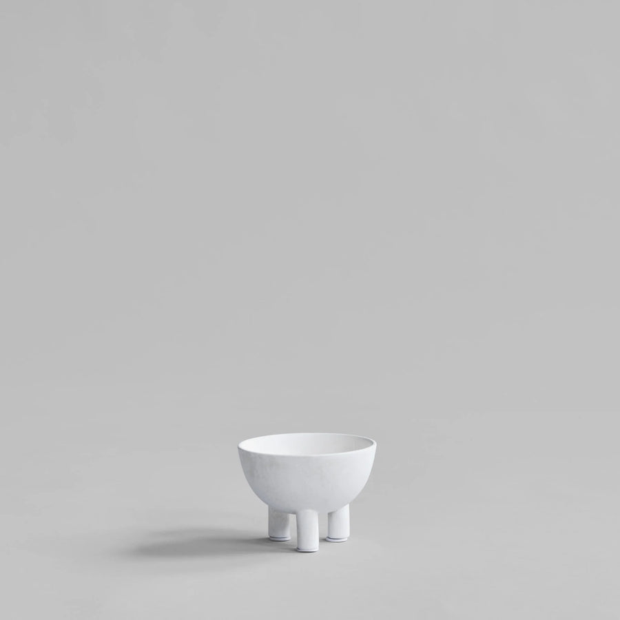 White ceramic bowl on a light gray background from 101 Copenhagen at Spacio retail stores in Mumbai & Kolkata. 