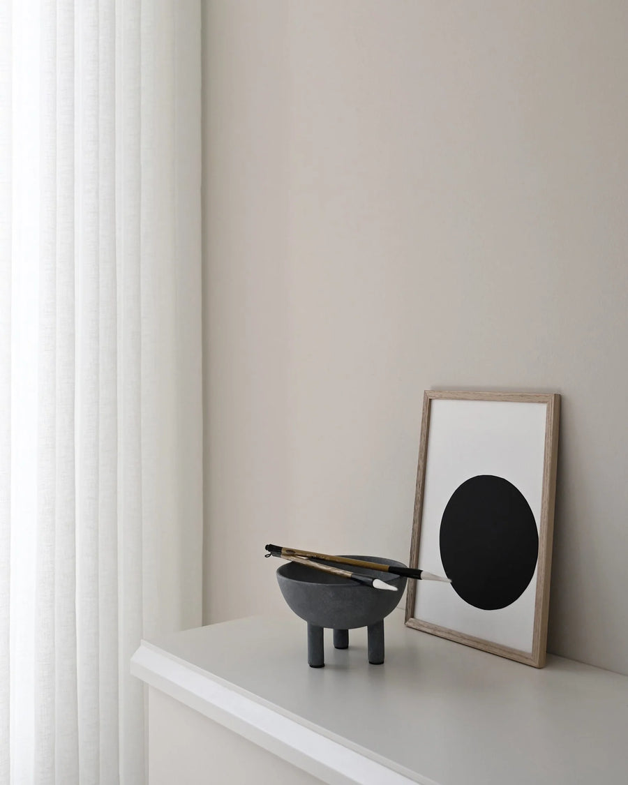 Modern interior with a black and white abstract art piece on a neutral wall from 101 Copenhagen at Spacio retail stores in Mumbai & Kolkata. 