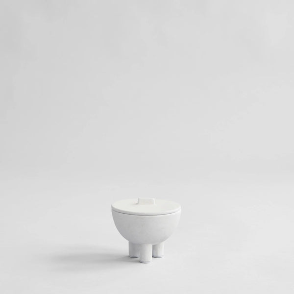 White ceramic bowl on a light gray background from 101 Copenhagen at Spacio retail stores in Mumbai & Kolkata. 