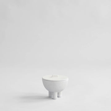 White ceramic bowl on a light gray background from 101 Copenhagen at Spacio retail stores in Mumbai & Kolkata. 