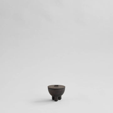 Small coffee ceramic bowl on a light gray background from 101 Copenhagen at Spacio retail stores in Mumbai & Kolkata. 