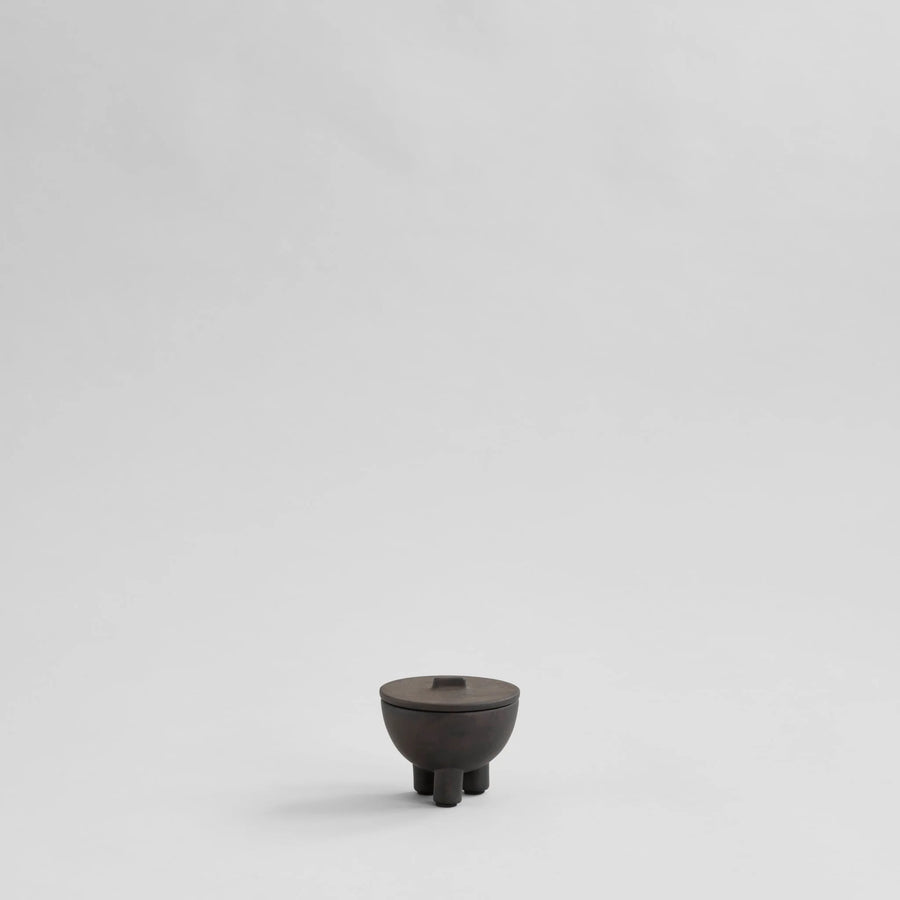 Small coffee ceramic bowl on a light gray background from 101 Copenhagen at Spacio retail stores in Mumbai & Kolkata. 