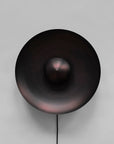 Dusk Wall Light Burned Black by 101 Copenhagen on a light grey background available at Spacio retail stores in Mumbai & Kolkata. 