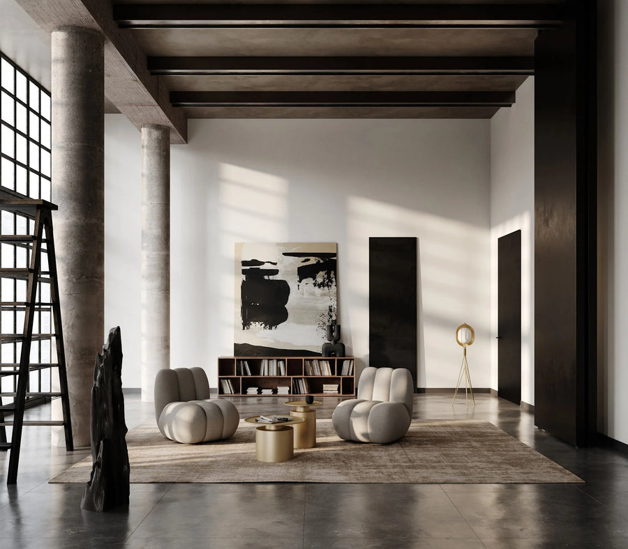 Modern living room with abstract art, bookshelf, and decorative items.