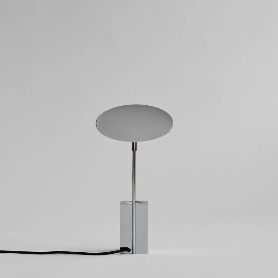Modern table lamp with a round shade on a gray background