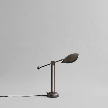 Vintage-style desk lamp on a light gray background from 101 Copenhagen available at Spacio retail stores in Mumbai & Kolkata. 