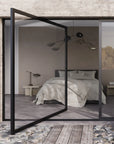 Modern bedroom with glass partition and natural light