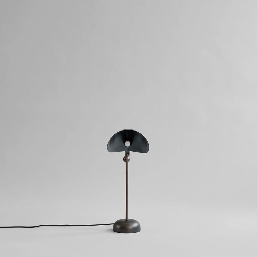 Black table lamp on a gray background