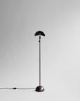 Black floor lamp on a white background