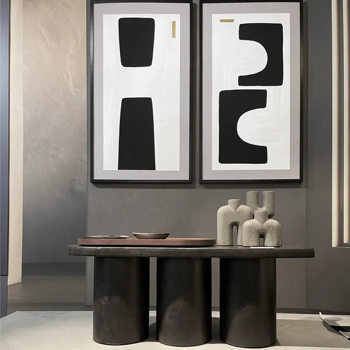 A room with two 101Cph Cobra Tall Mini Dark Grey 211034 vases and two framed pictures. (from the brand 101 Copenhagen)