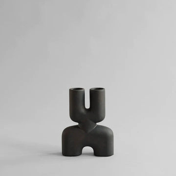 An organic-shaped 101Cph Cobra Double Mini Coffee 212002 vase displayed in an interior setting.