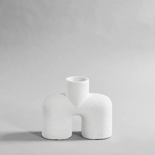 A 101Cph Cobra Uno Medio Bubble White 201012 vase on a grey background. The vase, from 101 Copenhagen's Cobra Uno Medio bubble collection, stands out in its pure white colour against the muted grey backdrop.