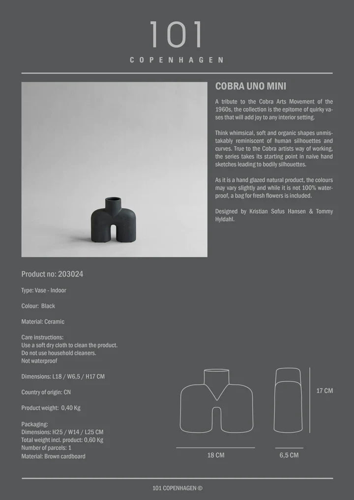 Discover the elegance of the 101Cph Cobra Uno Mini Black 203024 vase from 101 Copenhagen. This quirky black vase stands out beautifully against its dark background, showcasing a stunning black color that adds a touch of sophistication.