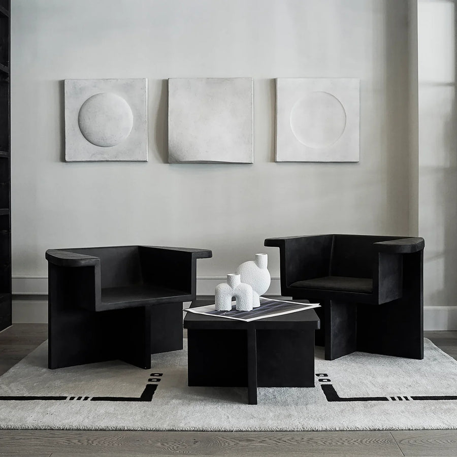 Two black 101Cph Cobra Uno Mini Bubble White 203021 chairs in a living room, featuring the Cobra Uno Mini Bubble design by 101 Copenhagen.